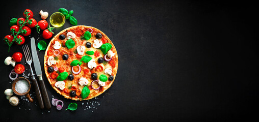 Delicious italian pizza on dark background