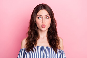 Fototapeta premium Photo of nice optimistic brunette lady look empty space blow kiss wear blue dress isolated on pink color background