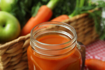 Jar with apple - carrot juice, close up