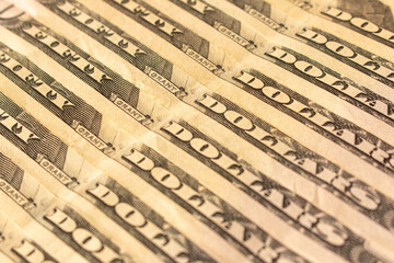 Abstract background of hundred-dollar bills. Selective focus.