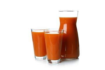 Glasses and pitcher of carrot juice isolated on white background