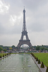 Fototapeta na wymiar View of the bridge Jena and the Eiffel Tower. Around the walk tourists and go cars