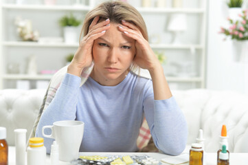 beautiful young ill woman at home