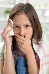 Close up portrait of sick  little girl with headache