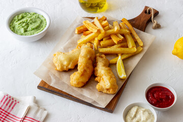 Fish and chips on a white background. British fast food. Recipes. Snack to beer. English cuisine.