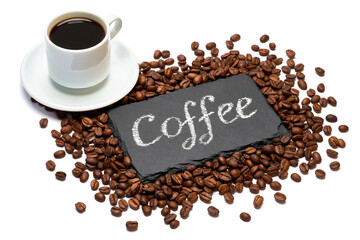 stone serving board with chalk handwritten sign, cup of espresso and coffee beans on white background