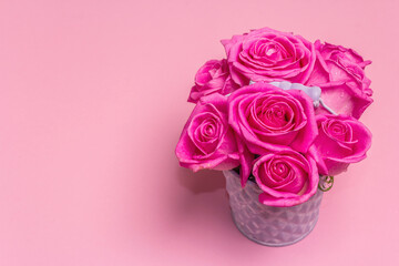 Bouquet of fresh pink roses in a bucket