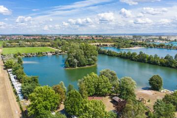 Fototapeta na wymiar View from the bird's eye view of the quarry ponds in the Hessian Ried / Germany in wonderful sunshine 