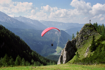 Skydivers in pairs in the Alps, who just took off. It is now time to take off! Alpine panorama in...