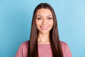 Fototapeta premium Photo of happy cheerful attractive young woman good mood smile wear pink t-shirt isolated on blue color background