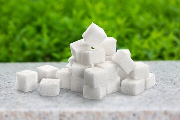 Cubes of white sweet sugar on the desk