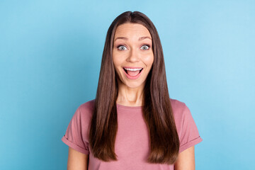 Fototapeta premium Photo of surprised happy young woman impressed discount good mood isolated on pastel blue color background