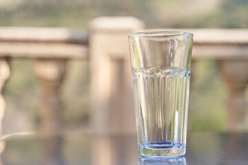 Empty transparent glass cup on table