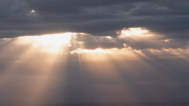 Heavenly Sun Rays Shining through Clouds Zoom Out Time Lapse