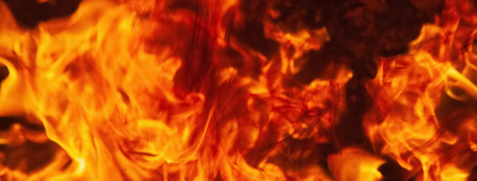 Dramatic pictures of fire flame background as symbol of hell and eternal pain. Horizontal image for design