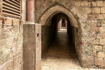 Tunnel  passage under residential buildings in the Muslim quarter near the exit from the Temple Mount - Chain Gate, in the old city of Jerusalem, in Israel