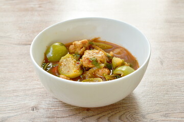 spicy boiled feather back fish ball with vegetable curry soup on bowl