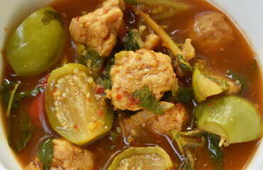 spicy boiled feather back fish ball with vegetable curry soup on bowl
