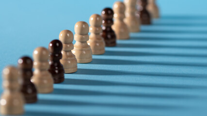 chess pieces in a row, Colorful chess pieces on a blue background,