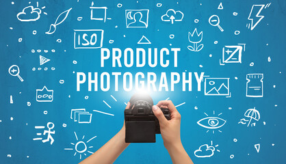 Hand taking picture with digital camera