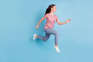 Fototapeta na wymiar Full body profile side photo of excited positive young lady jump up run sale isolated on blue color background