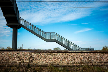 pedestrian metal bridge elevated walkway over british railroad in england