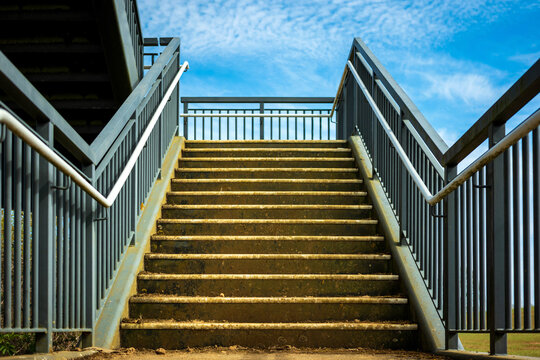 pedestrian metal bridge elevated walkway over british railroad in england