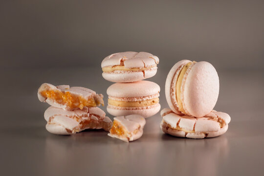 Desserts. Pastry, bakery and branding concept - French macaroons on cream beige background, parisian chic cafe dessert, sweet food and cake macaron for luxury confectionery brand