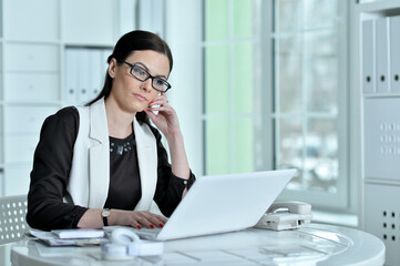 Fototapeta premium Portrait of businesswoman working in office