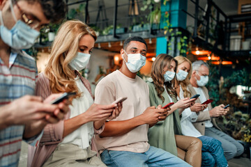 Group of people working in office during Covid-19