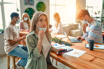 Group of people working in office during Covid-19
