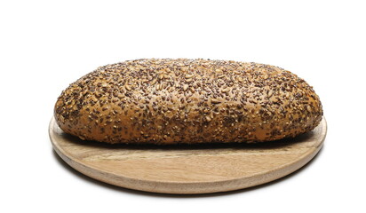 Integral dark rye bread with seeds on round wooden plate isolated on white background