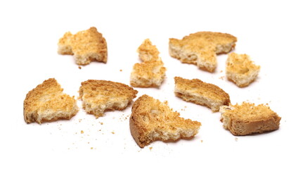 Broken rusks pile, broken pieces with crumbs with crumbs isolated on white background