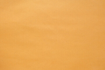 Texture of brown craft or kraft paper background, cardboard sheet, recycle carton paper, copy space for text.