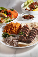 Turkish Adana Kebab with Vegetables on the Plate