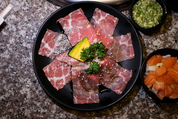 beef or sliced beef , raw beef and salmon salad