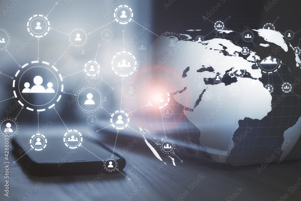 Poster Social communications concept with digital screen with media signs of person connected by lines and part of Earth planet on table background with smartphone and laptop