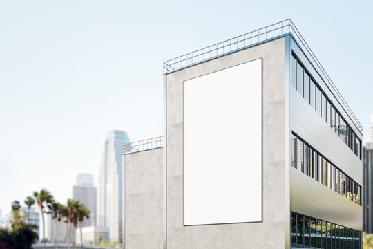 Blank White Outdoor Billboard On Facade Modern Industrial Building On Sunny City Background. 3D Rendering, Mock Up