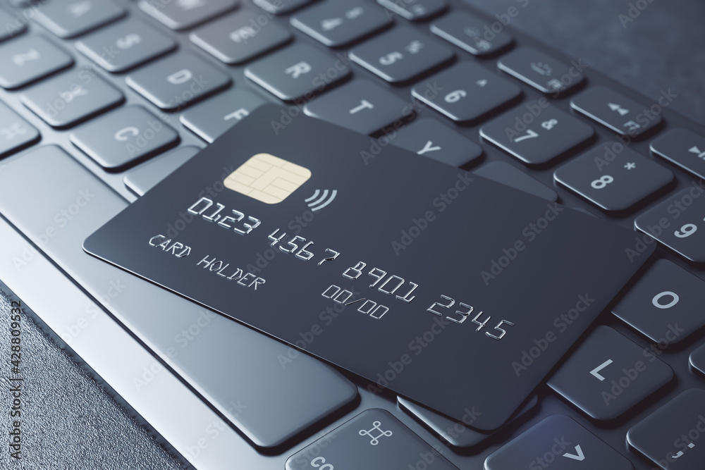 Poster privilege online banking concept with black credit card on dark computer keyboard