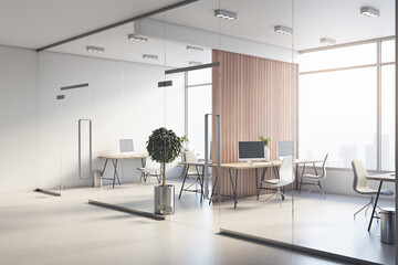 Modern open space office behind glass walls with wooden floor, stylish furniture and city view from huge windows