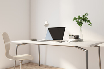 Stylish workspace in home office with light table and chair, modern laptop, plant in transparent vase and black coffee mug