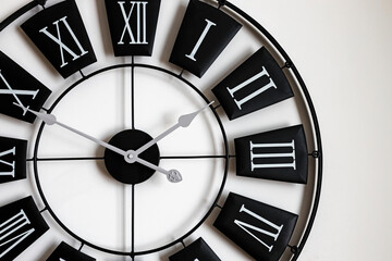 Close-up of black and white classic wall clock