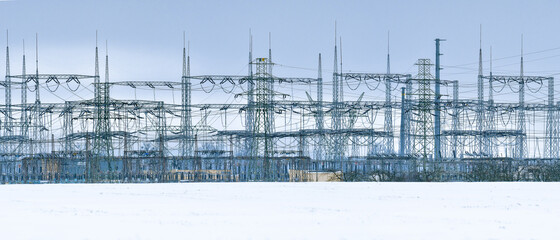 Electricity transmission lines with transformer stations.