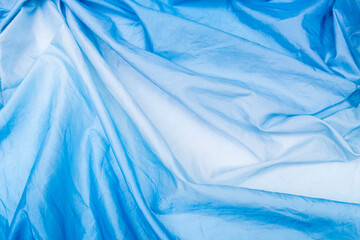 Abstract  wrinkle fabric Blue Gradient background, blank blue fabric texture background