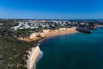 Obraz na płótnie Canvas Aerial view of the scenic Algarve coastline, with beaches and resorts; Concept for summer vacations in Portugal
