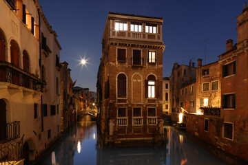 Fototapeta na wymiar Floating house and canal in Castello, Venice, Italy