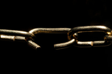 The weak link in the work chain close up view in black background