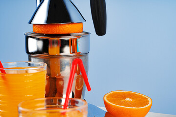 Metal hand orange juice squeezer close up