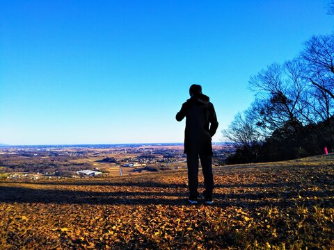Standing man on hill