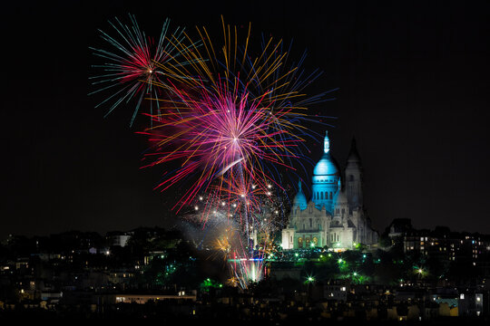 Firework display at The Basilica of the Sacred Heart (Sacre Cœur Basilica) during Fete des Vendanges. Montmartre, Paris, France